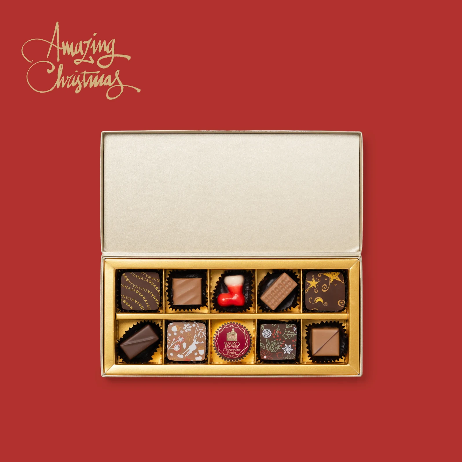 よりどりみどりの一口サイズチョコレートが10個、それぞれに緻密な装飾が施され、頑丈なギフトボックスに整然と並べられている様子